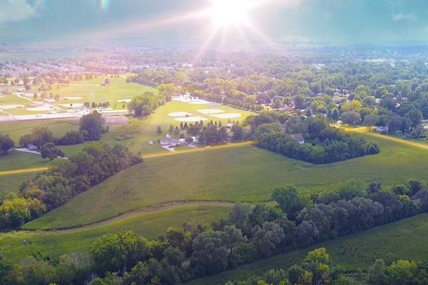 Aerial view of altoona and stats of residential increase to 20,000 residents, 223 new residential building permits